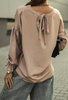 Luźna bluzka w kolorze pudrowego różu z wiązaniem na plecach i ściąganymi rękawami