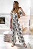 Biały kombinezon damski w tropikalny wzór z szerokimi nogawkami JAMIE