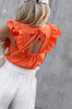Pomarańczowa bluzka damska z falbaną i wiązaniem na plecach DONNA