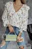 Biała bluzka damska w drobne kwiaty z falbaną z przodu i wiązaniem na plecach NICOLE