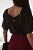 Czarna lekko błyszcząca   bluzka damska  z kokarda na plecach SYDNEY    