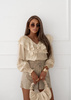Beżowa  bluzka damska  z ozdobną falbaną CRYSTAL